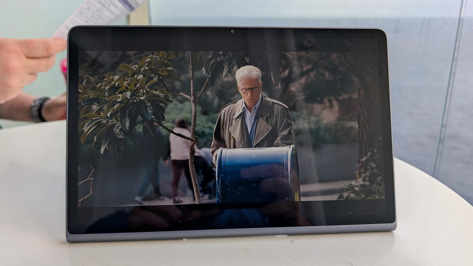 Lenovo Tab Plus sitting on a white table on a cruise showing a Netflix show.