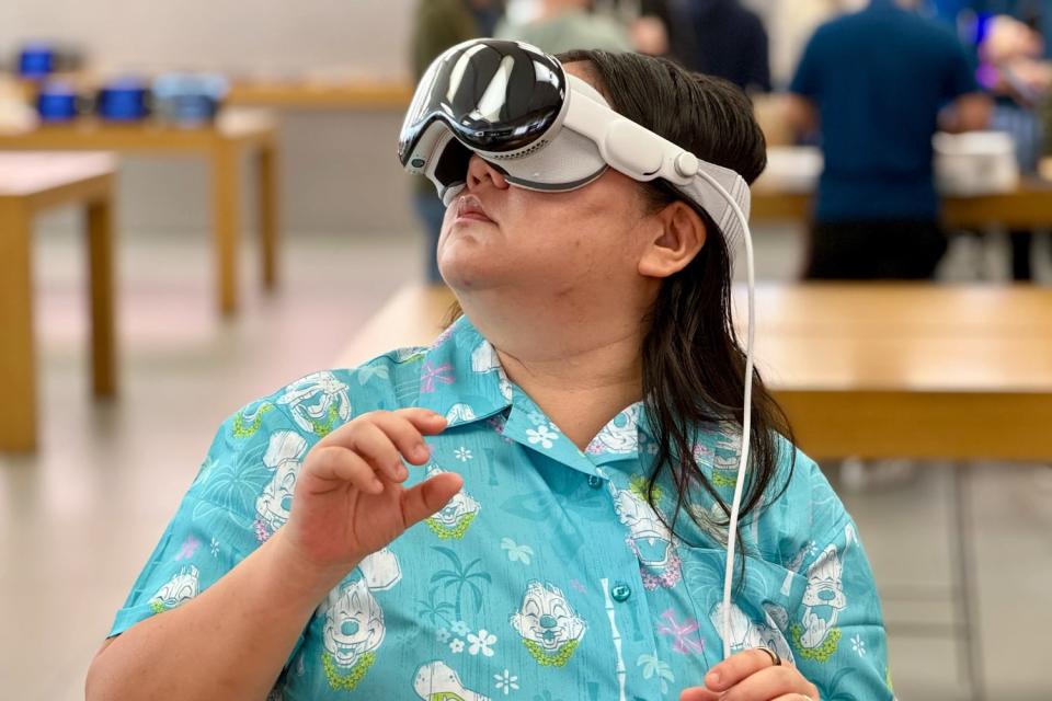 A person wearing the Apple Vision Pro demo unit in an Apple Store.