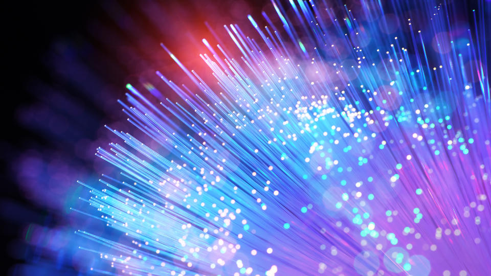  Colorful optical fiber cables against black background. 