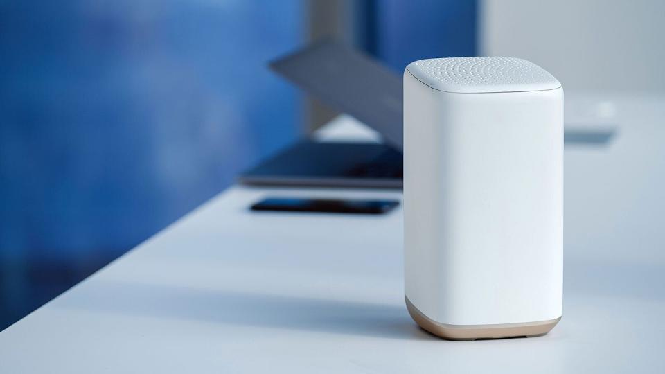 A photo of a Comcast modem/router sitting on a desk.