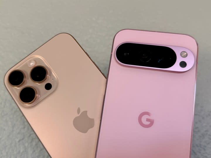 Apple iPhone 16 Pro Max in Desert Titanium (left) and a Rose Quartz Google Pixel 9 Pro.