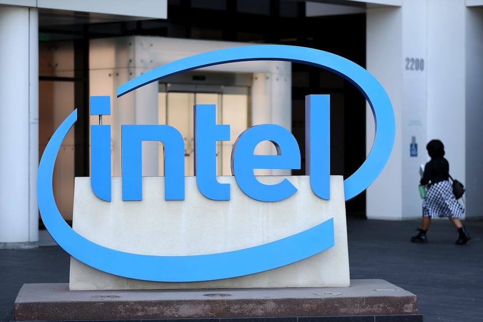 Intel logo and a person walking in the background