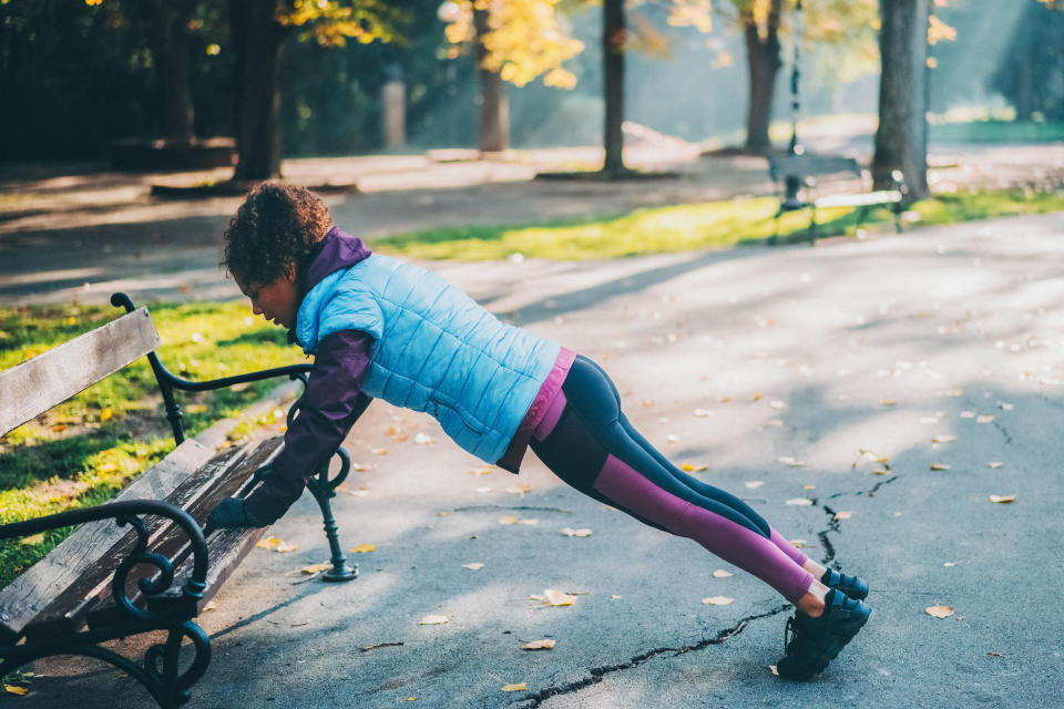 Sportswoman training among nature