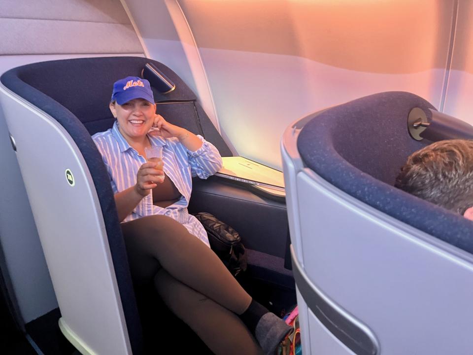 Relaxing with a glass of champagne in Finnair’s business class seat, enjoying the privacy and comfort that made the flight feel like a luxury retreat.