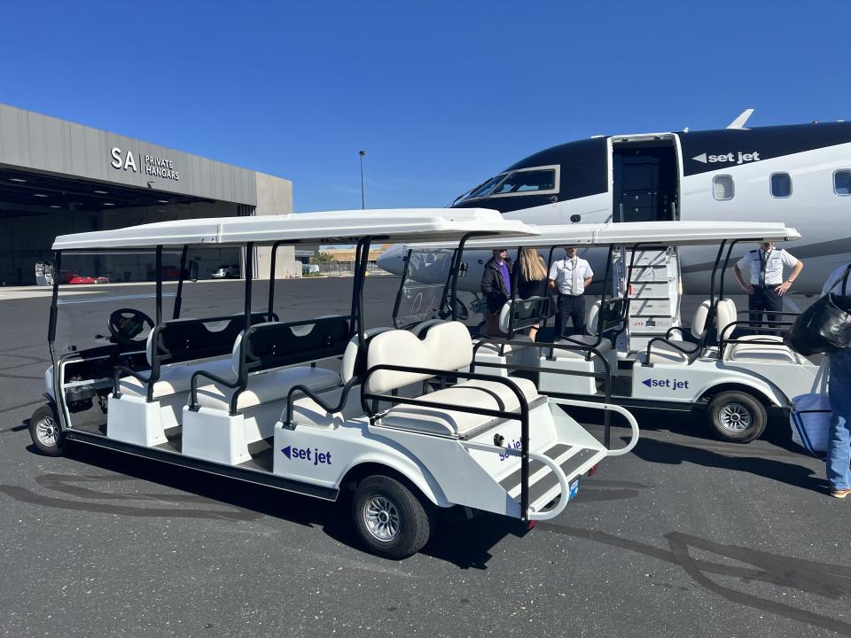 Set Jet’s semi-private travel experience began with a golf cart ride across the tarmac to the semi-private Challenger 850 plane.