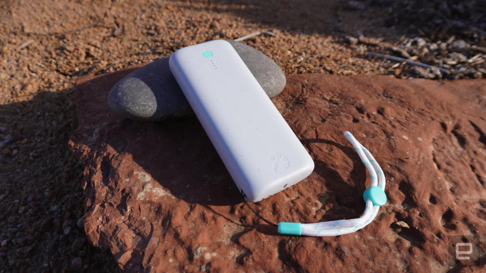 The Nimble Champ Pro battery pack sits on a rock outdoors in the early morning sun. 