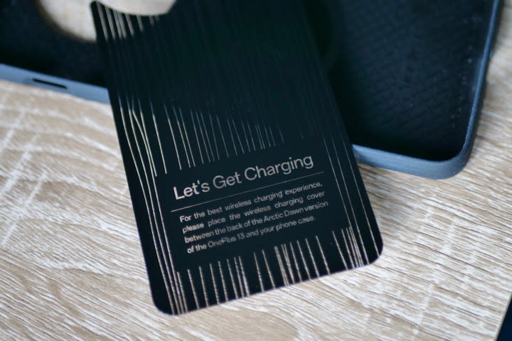 The wireless charging insert that comes with the OnePlus 13's case.