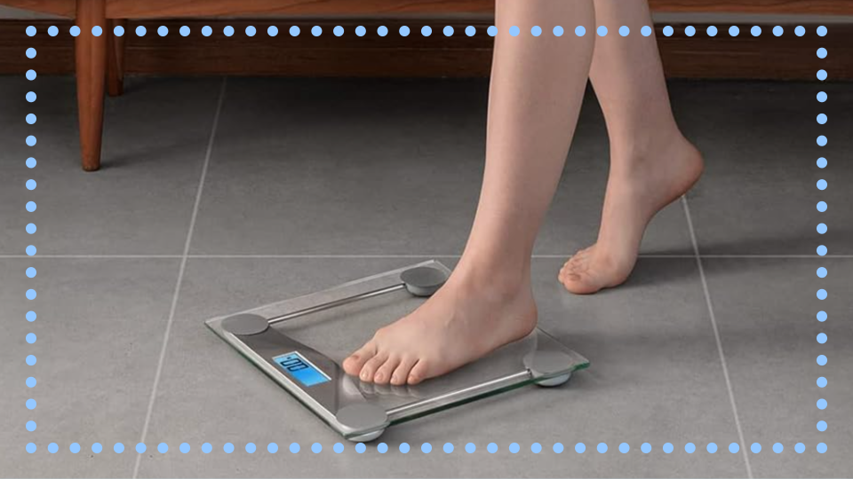 person stepping on etekcity bathroom scale