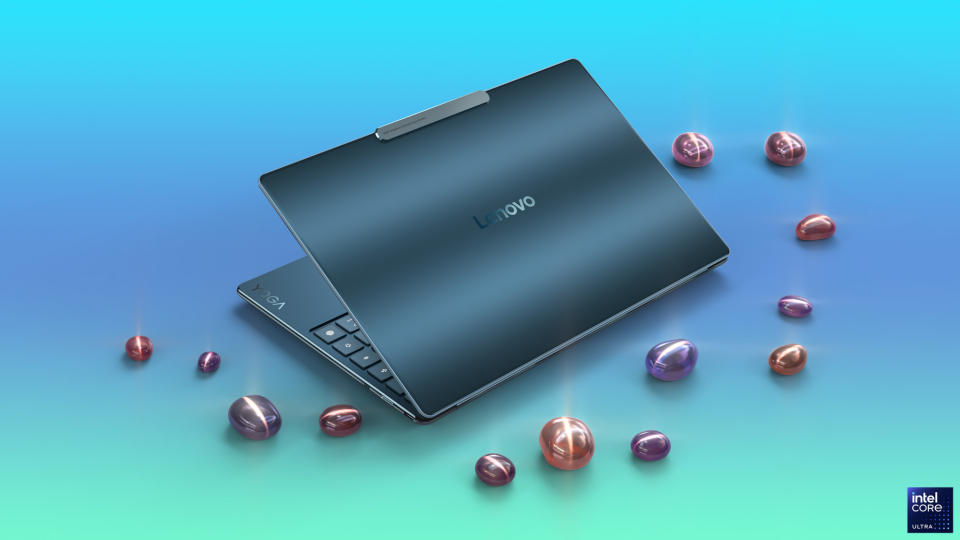 Lenovo Yoga Slim 9i open on a blue to green gradient background.