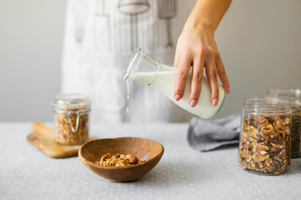 Milk being poured in to a bowl.