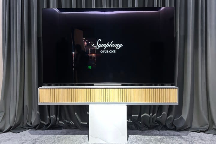 Dynaudio Symphony Opus One below an 83-inch TV.