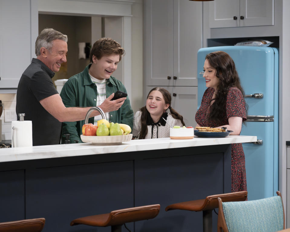 Allen, Maxwell Simkins, Barrett Margolis and Dennings stand at a kitchen counter in a scene from Shifting Gears.