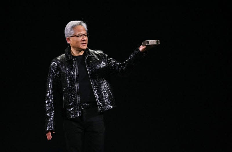 Nvidia CEO Jensen Huang holds a personal AI supercomputer during his keynote at the Consumer Electronics Show (CES) in Las Vegas, Nevada on January 6, 2025. - Photo: Patrick T. Fallon/AFP (Getty Images)