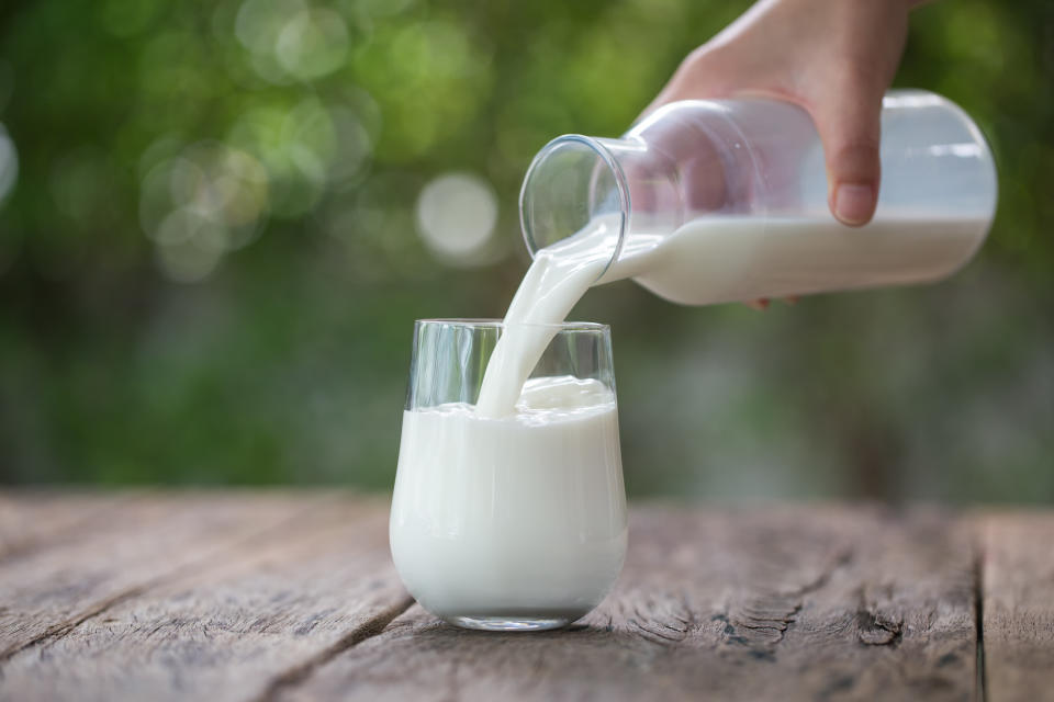 Milk being poured into a glass.