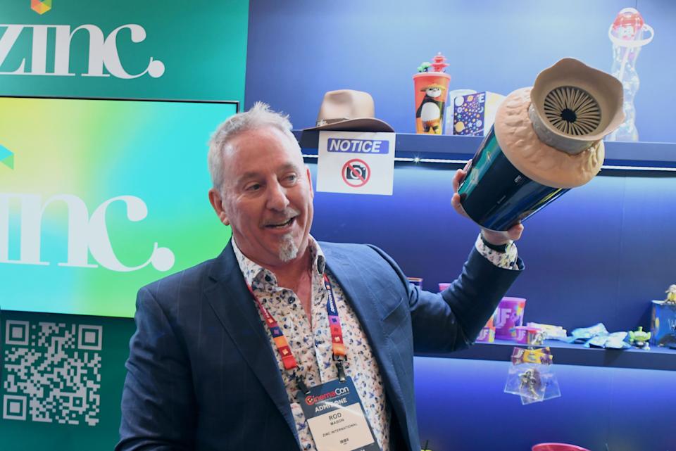 Zinc's Rod Mason holds an elevated concessions vessel.