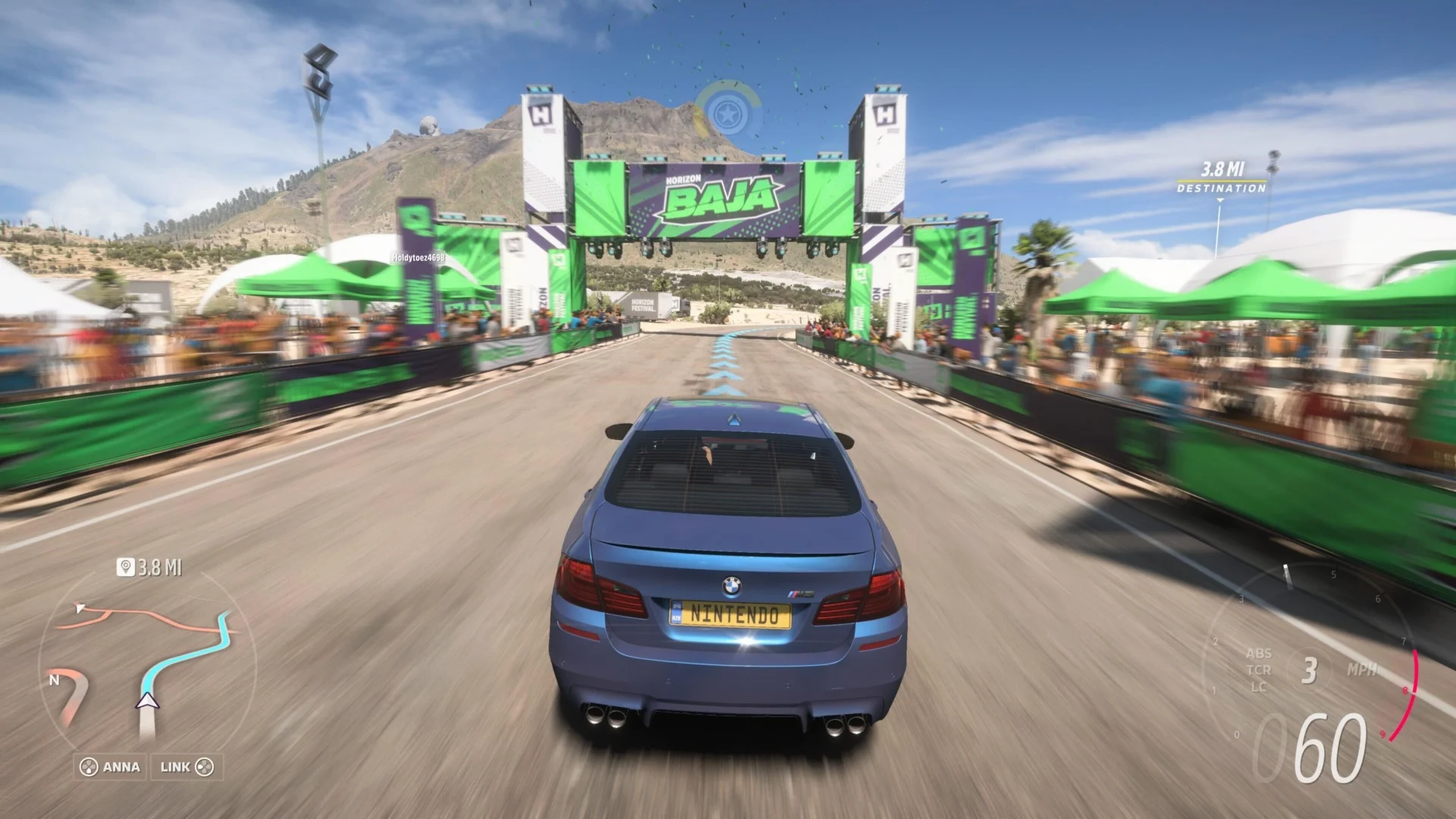 A customized Nissan Skyline driving through a vibrant Mexican landscape in Forza Horizon 5