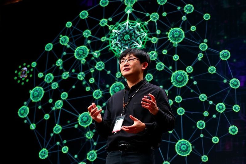 Jensen Huang presenting NVIDIA Agent Toolkit at GTC 2026 with holographic nodes