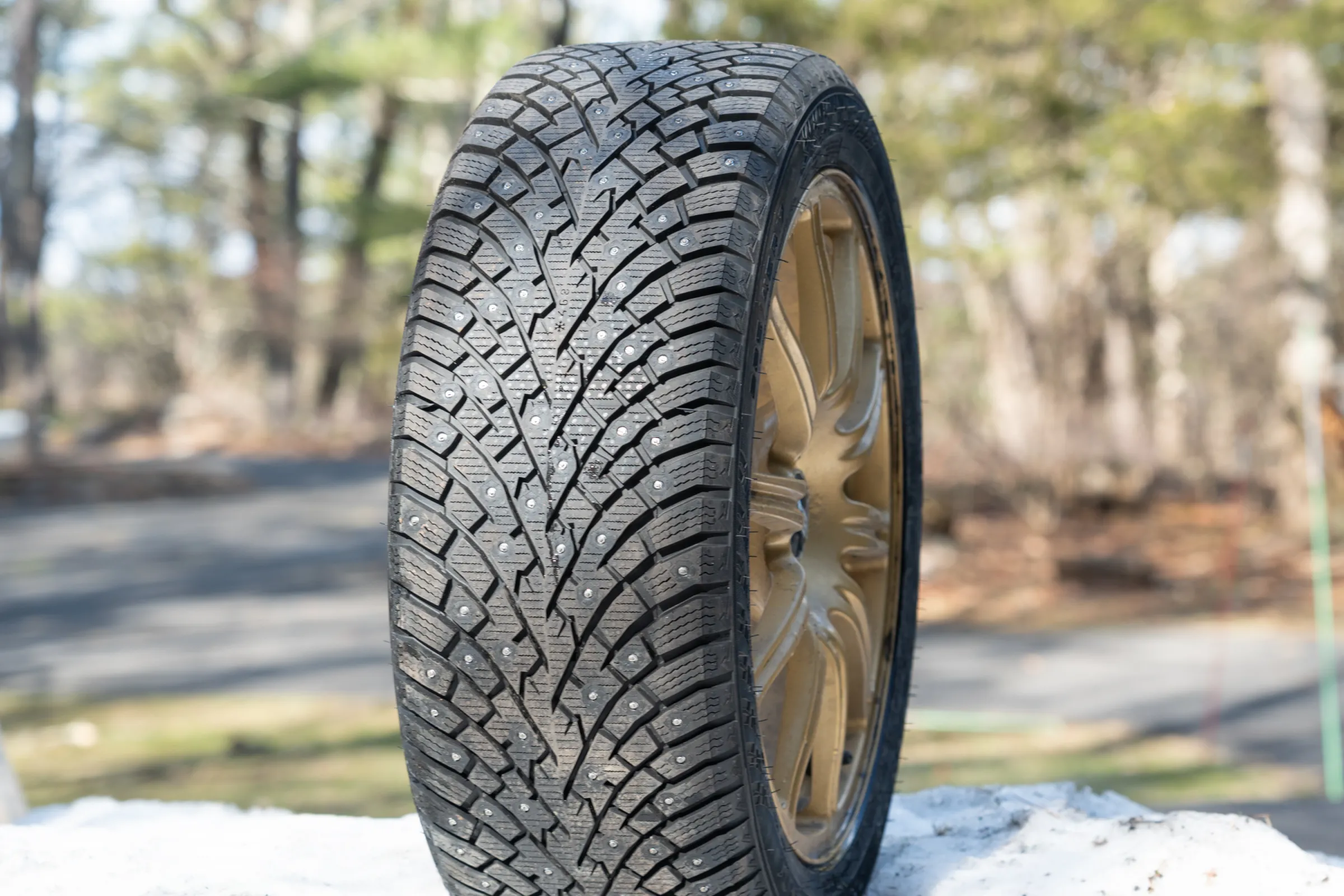 Close-up of Nokian Hakkapeliitta 01 retractable studded tires showing the tungsten tips