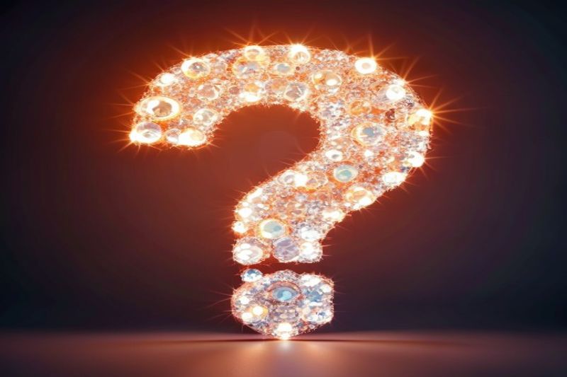 A question mark made of glowing light bulbs representing turning FAQs into ebook ideas
